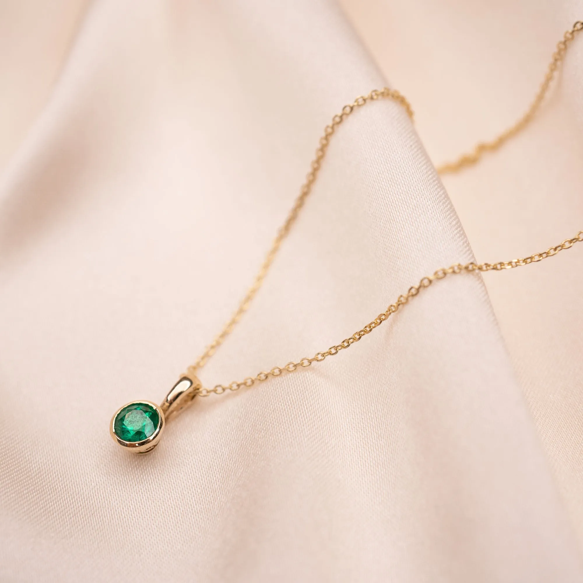 14k Circular Emerald Bezel Necklace
